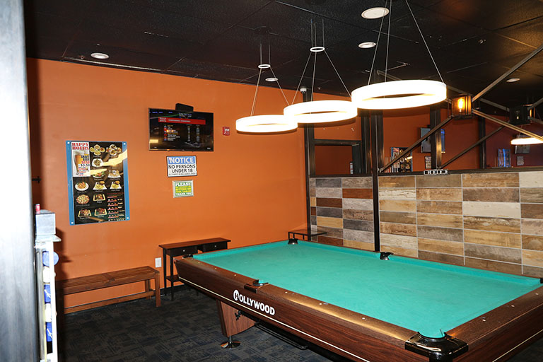 Billiards table with divider